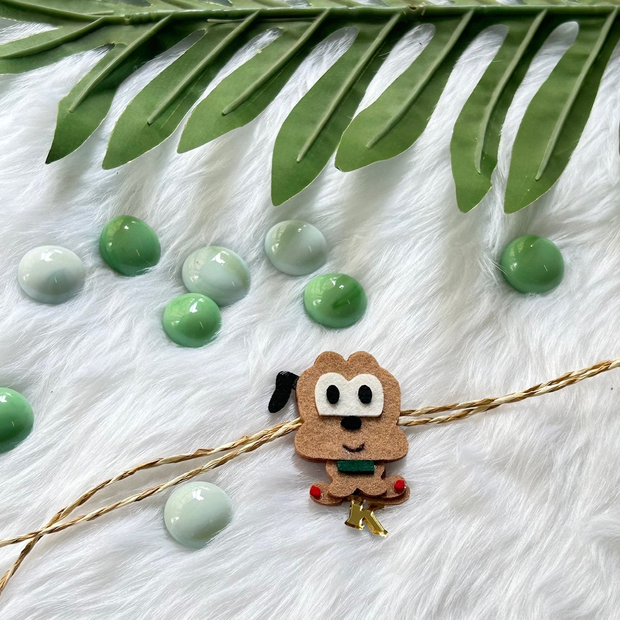 Babble Wrap Handmade Felt Rakhi With Initials - Pluto